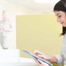 A young woman looking at a tablet