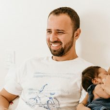 Family with two children sitting on a sofa