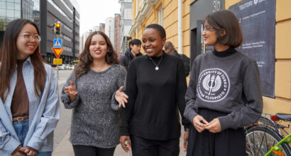 Four MPD students walking on the street.