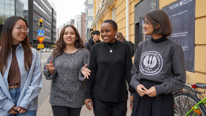 Four MPD students walking on the street.