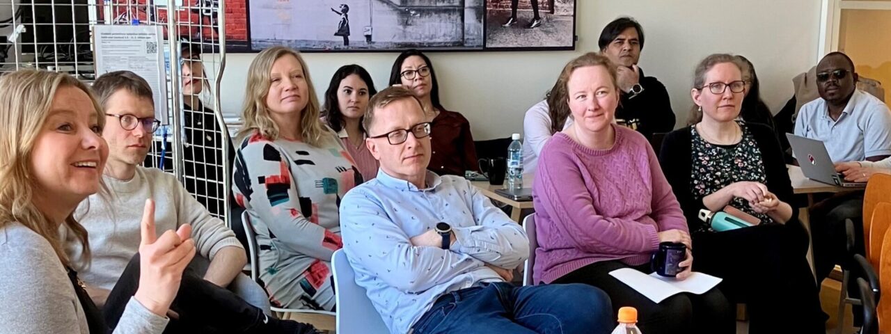 Group of people in the coffee room.