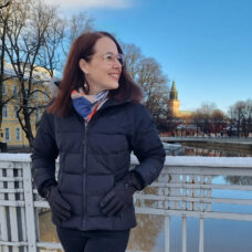 Julie Blake standing on a bridge in Turku.