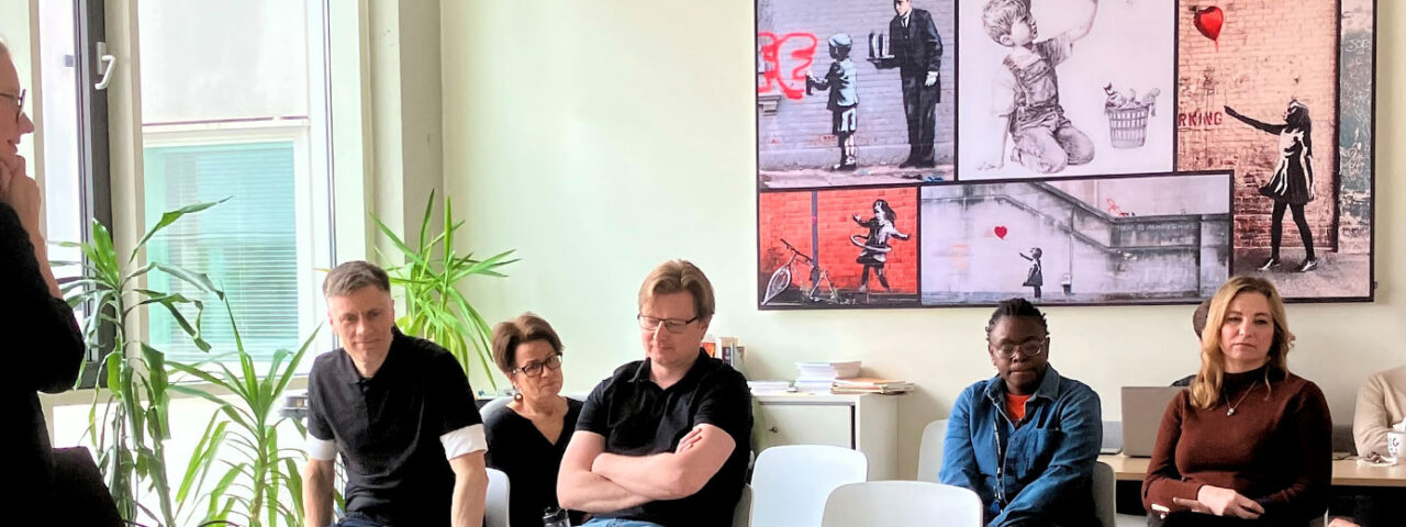 Group of people in the coffee room.