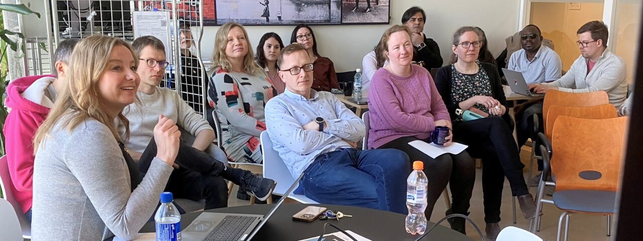 Goup of people iin the coffee room.