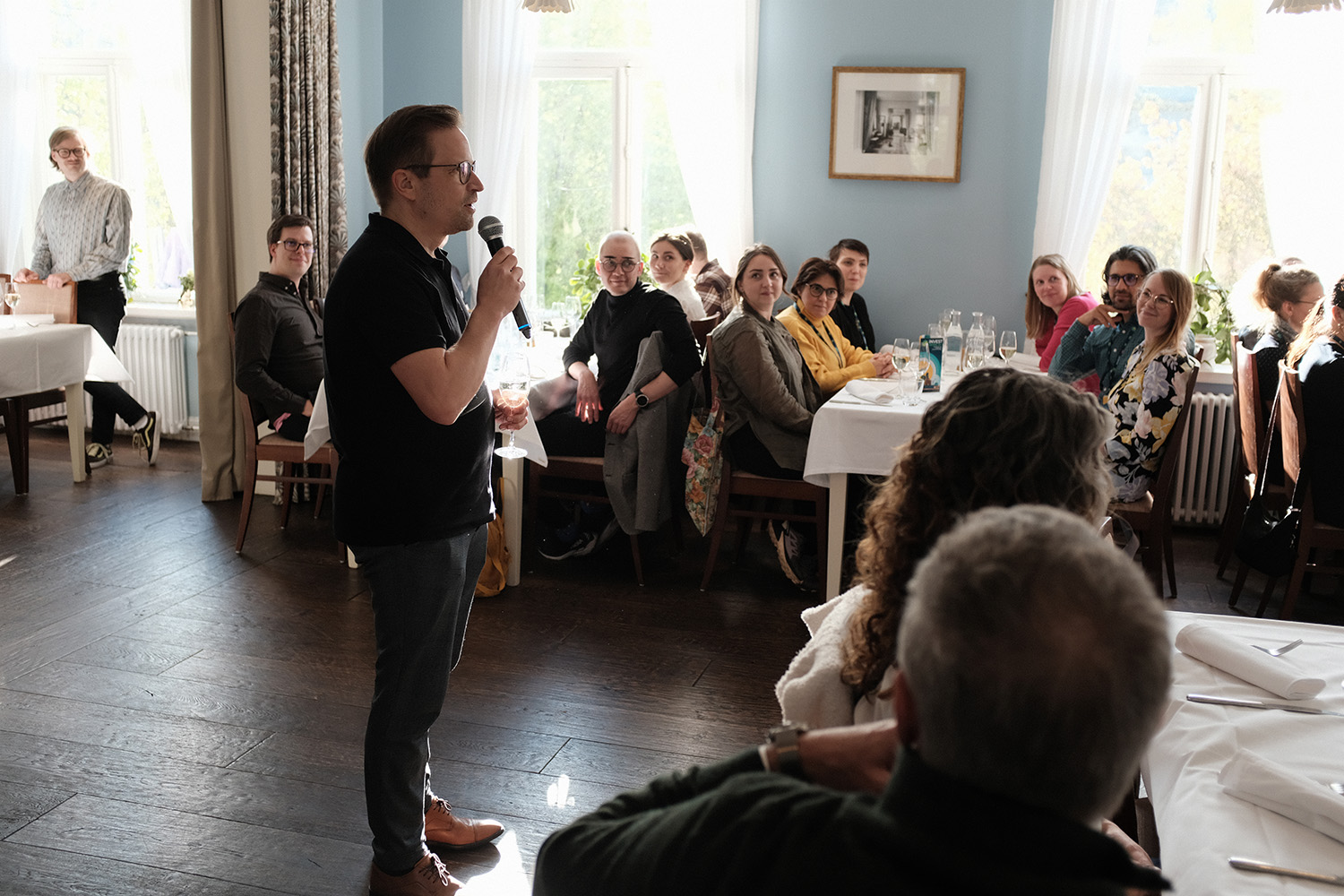 INVEST Conference dinner, people sitting on table
