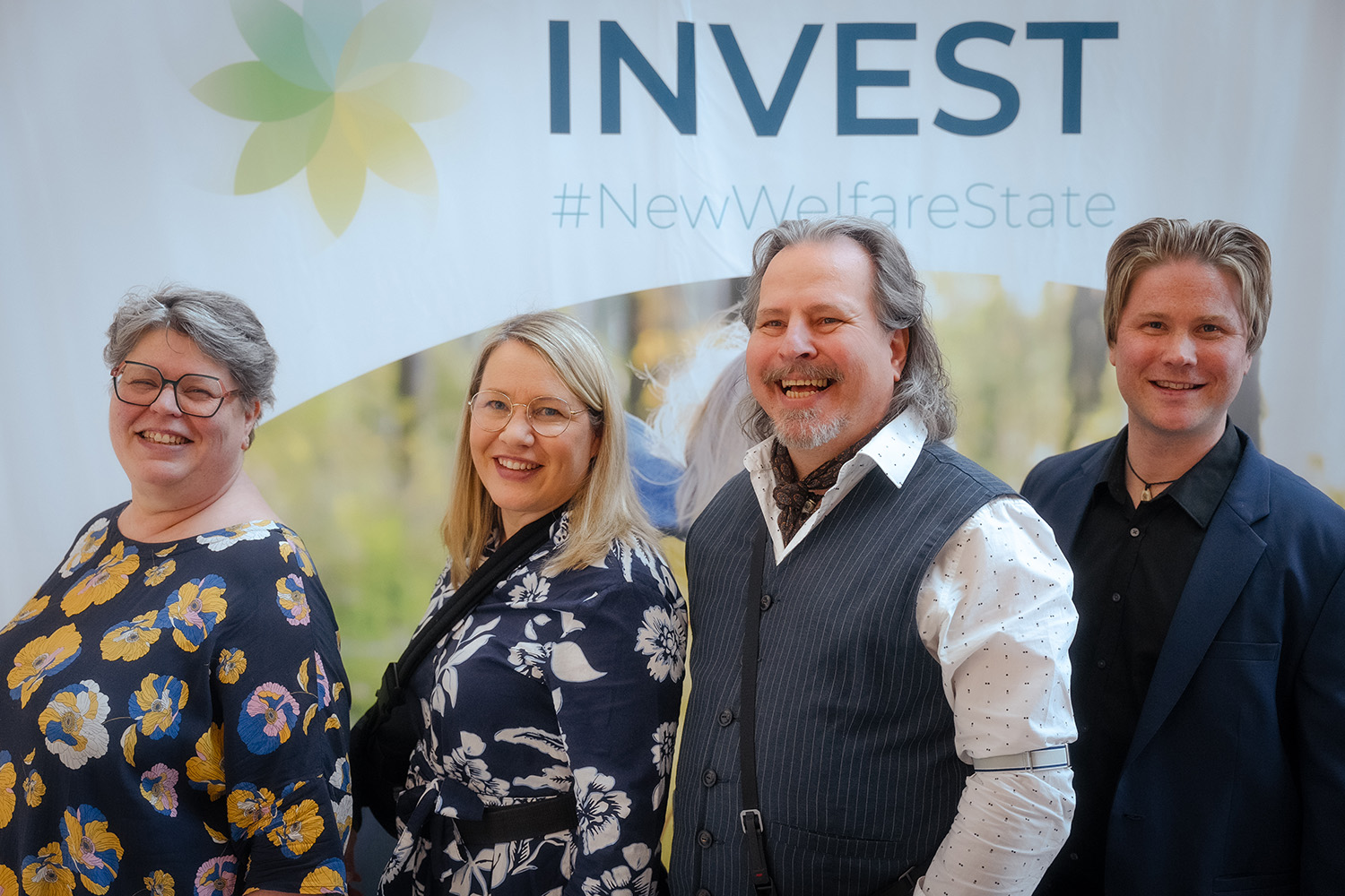 Smiling people at INVEST Conference