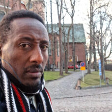 Man in front of a building