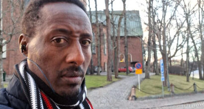 Man in front of a building