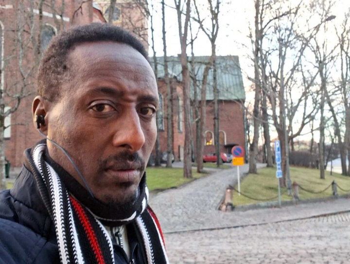 Man in front of a building